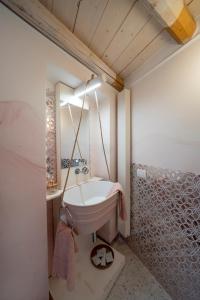 a bathroom with a sink and a mirror at New Dimora Valmar in Polignano a Mare