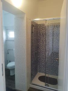 a bathroom with a shower and a toilet at Apartmani Viktorija in Fažana