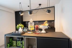 a kitchen with a counter with vases on it at New Dimora Valmar in Polignano a Mare
