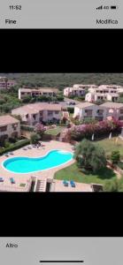 a picture of a resort with a swimming pool at Residence Uliveto app 33 Birgalavo' in Agrustos