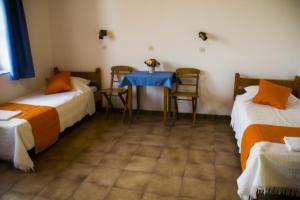 A bed or beds in a room at Medieval Rose Guest House