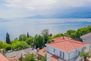 an aerial view of houses and the water at Guest House More in Rijeka