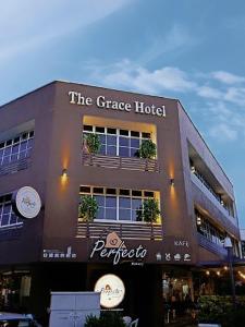 a building with plants on the side of it at The Grace Hotel in Muar