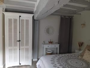 Posteľ alebo postele v izbe v ubytovaní Chambre d'hote Familiale de la maison Bleue