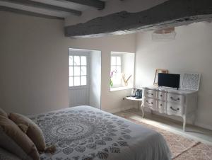 Posteľ alebo postele v izbe v ubytovaní Chambre d'hote Familiale de la maison Bleue