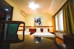 Postel nebo postele na pokoji v ubytování Hotel Vila Vrbas