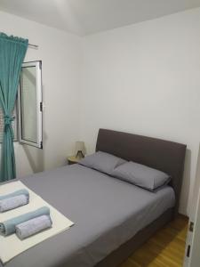 Postel nebo postele na pokoji v ubytování Apartman Jovan