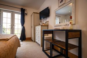 TV a/nebo společenská místnost v ubytování Conwy Pen Cefn Farm Holiday