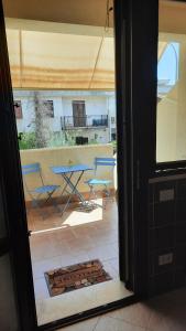 a view of a patio with a table and chairs at Casa Vacanze San Vito Lo Capo in San Vito lo Capo