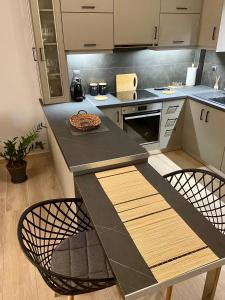 Η κουζίνα ή μικρή κουζίνα στο Cozy flat elix