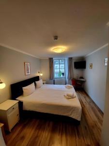 Postel nebo postele na pokoji v ubytování Hotel am Markt
