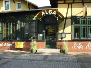 aania store on the street in front of a building at Hotel Alga in Ustka