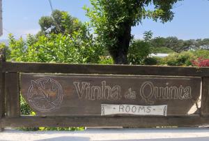 a wooden sign for the wynkoahahoahoahoolis rooms at Vinha da Quinta in Sintra