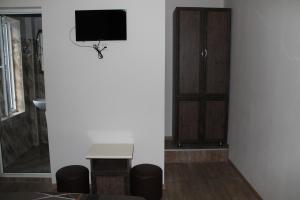 TV o dispositivi per l'intrattenimento presso Ponto Hotel