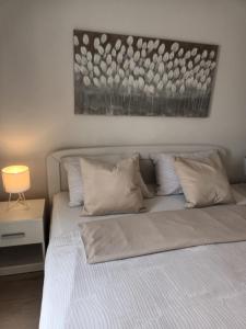 Кровать или кровати в номере Apartment & Rooms Riva