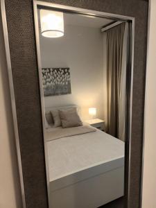Кровать или кровати в номере Apartment & Rooms Riva