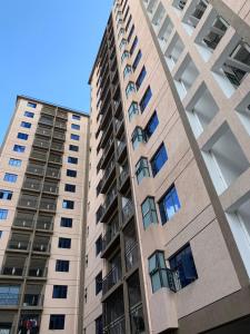 two tall apartment buildings in a city at New Luxury Apartment close to State House Nairobi in Nairobi