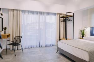BLUE STONE Luxury Suites客房内的一张或多张床位