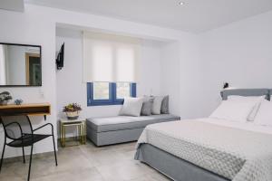 BLUE STONE Luxury Suites客房内的一张或多张床位