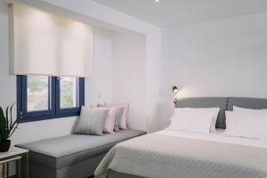 BLUE STONE Luxury Suites客房内的一张或多张床位