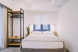 Posteľ alebo postele v izbe v ubytovaní BLUE STONE Luxury Suites