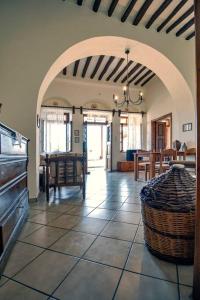 a living room with an archway and a dining room at PK Residency in Falatados in Mési