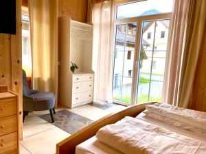 Rúm í herbergi á Haus 26 Weißbriach