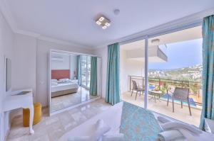 a living room with a view of a bedroom at Hatice Sultan Villa in Kalkan