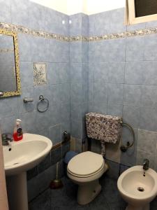 Et badeværelse på Vogli's House Apartments & Rooms