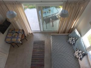 an aerial view of a living room with a dining table at KTIMA MORAITI - Seaside Houses in Katerini