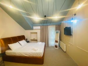 Postel nebo postele na pokoji v ubytování Mose art Hotel