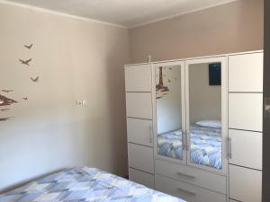 Posteľ alebo postele v izbe v ubytovaní Apartman Flora's Garden