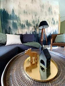 a living room with a coffee table in front of a couch at Frafjord Apartments Frøya in Dirdal