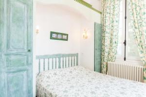 Postel nebo postele na pokoji v ubytování Hotel Villa Provencale