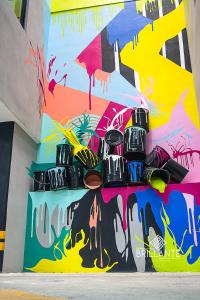 a group of shoes on a wall with graffiti at Condominio Brillante GDL in Guadalajara