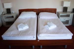 Posteľ alebo postele v izbe v ubytovaní Elita Hotel & Restauracja