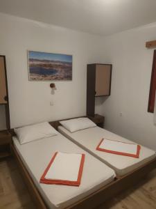 Posteľ alebo postele v izbe v ubytovaní Apartmani BRUNO