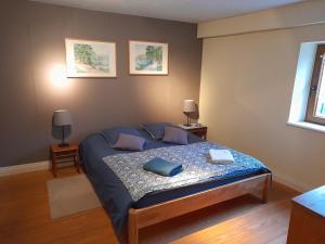 Ένα ή περισσότερα κρεβάτια σε δωμάτιο στο La maison du vannier