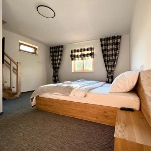 מיטה או מיטות בחדר ב-Roubenka pod Lysou - Malenovice