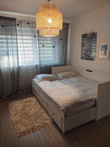 Tempat tidur dalam kamar di Christiana Andersena - apartamenty