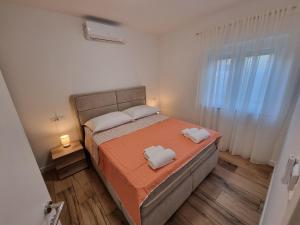 Postel nebo postele na pokoji v ubytování Apartman Lovre