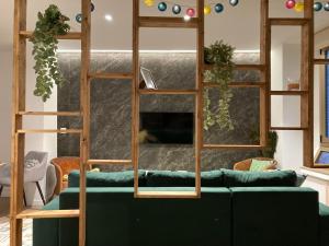 a living room with a couch and a bunk bed at Romea Suites in Murcia