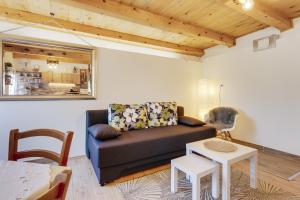 a living room with a couch and a table at guesthouse LIPA in Korenica +39 photos