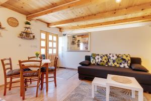 a living room with a couch and a table at guesthouse LIPA in Korenica