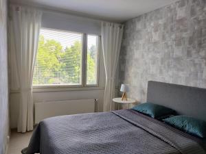 Postel nebo postele na pokoji v ubytování Nika Apartments