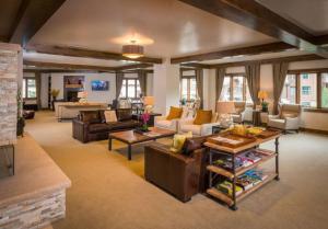 a large living room with couches and a couch at Ski, In Ski Out 3 Bedroom Vacation Condo With Resort Amenities That Include Exercise Center, Indoor Pool, And Hot Tubs in Beaver Creek