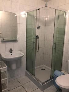 a bathroom with a shower and a sink at Willa Puchatek in Gąski +162 photos