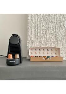 a black toaster sitting next to a box of matches at Coup de Coeur au pied du château - Nice studio ideally located in Annecy