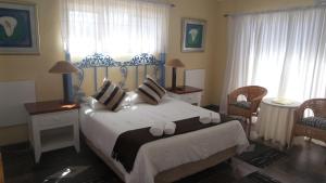 Ένα ή περισσότερα κρεβάτια σε δωμάτιο στο Sir Lambert's Guesthouse