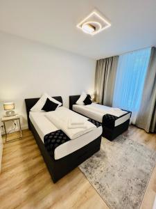 Voodi või voodid majutusasutuse ND Hotels & Apartments Zentrum Mülheim toas
